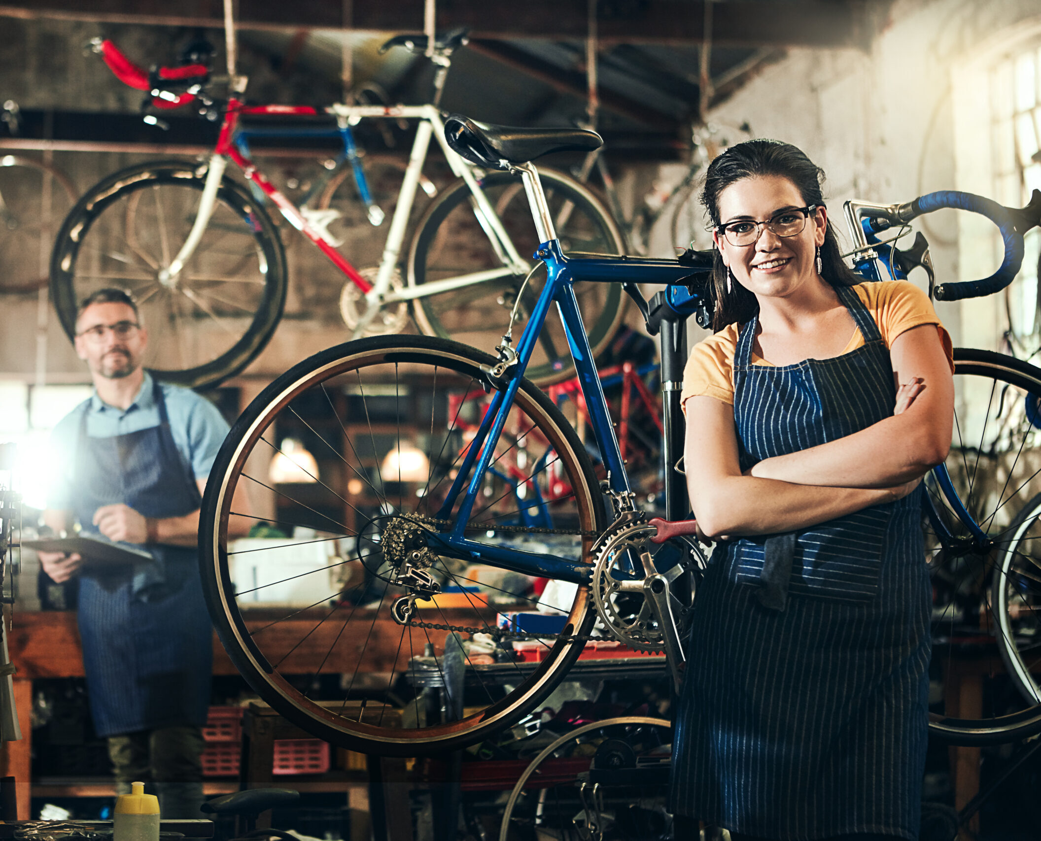 Bicycle mechanic standing in a repair workshop