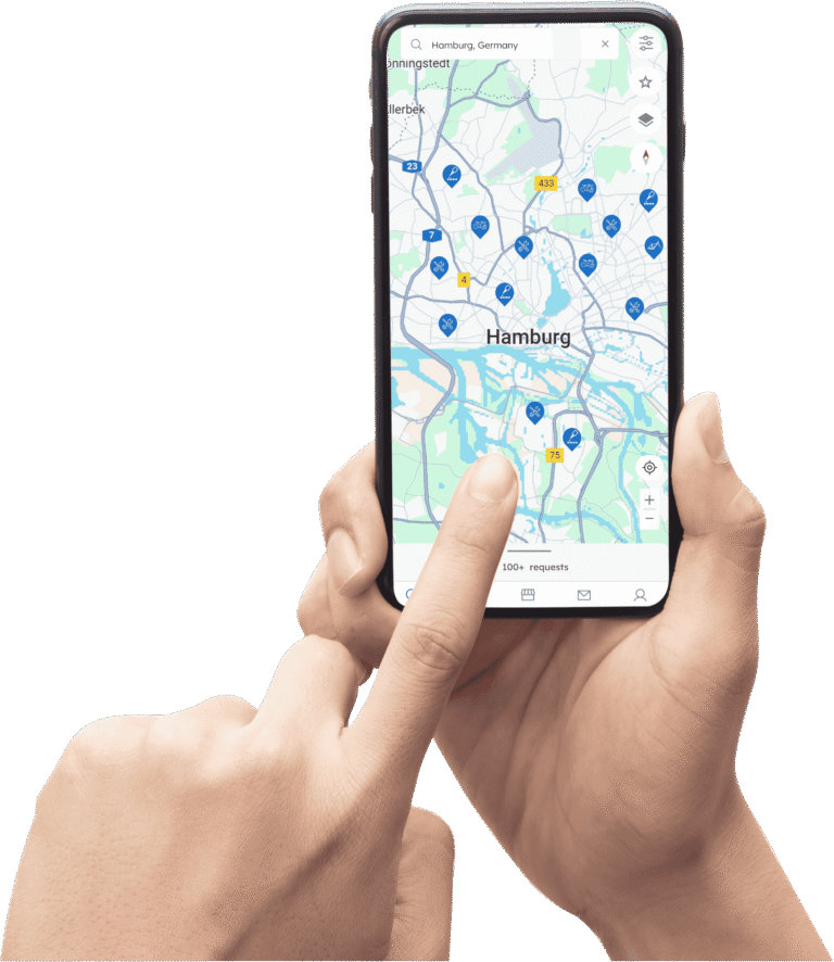 Nutzer hält ein Smartphone mit der PEDAL24 App und sucht Fahrradmechaniker und Fahrradreparatur-Services in Hamburg